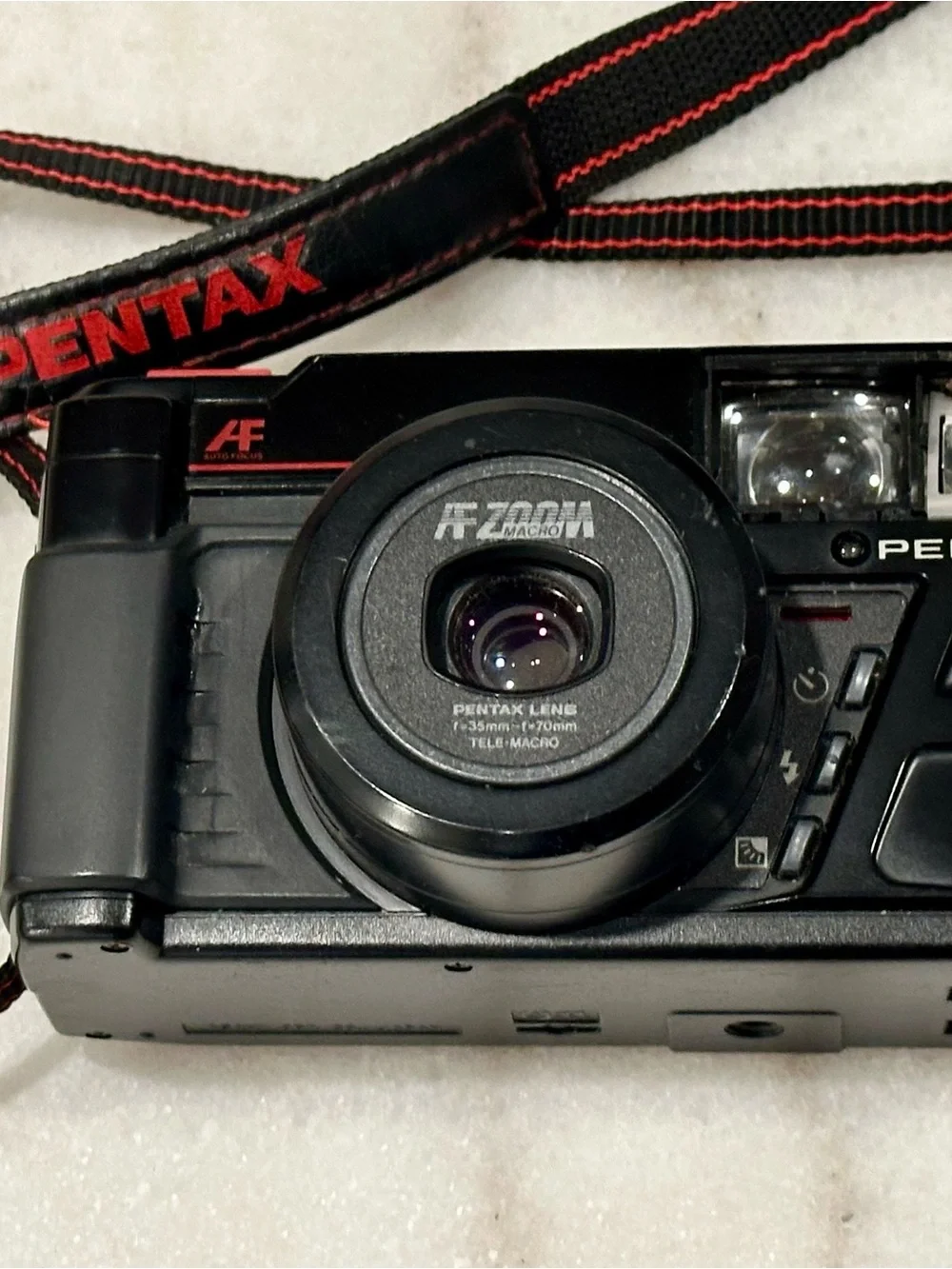 Pentax Black Point-and-Shoot Film Camera with Red-Trim Strap